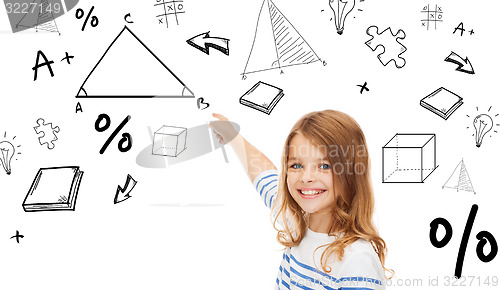 Image of girl pointing to triangle on virtual screen