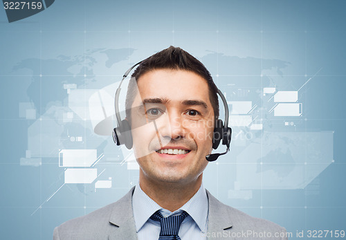 Image of smiling businessman in headset