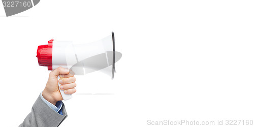 Image of businessman in suit speaking to megaphone