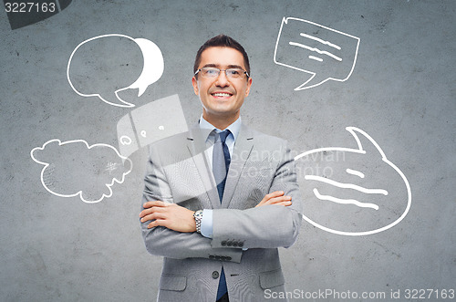 Image of happy smiling businessman in eyeglasses and suit