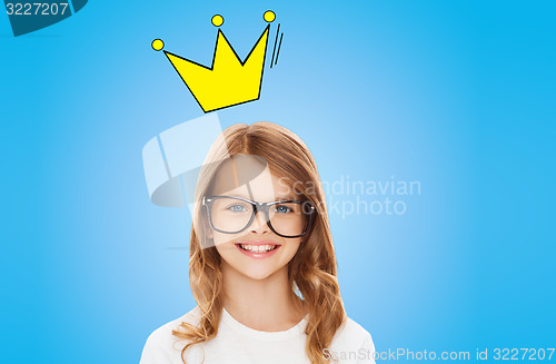 Image of smiling little girl in glasses with crown
