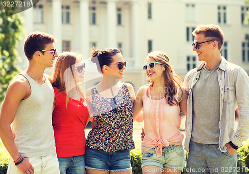 Image of group of smiling friends outdoors