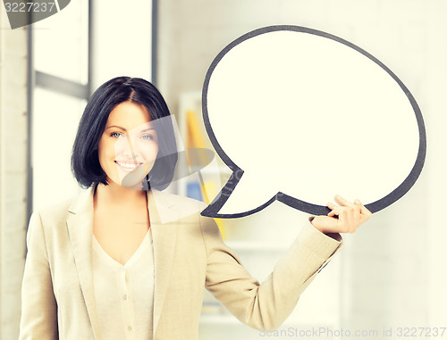 Image of smiling businesswoman with blank text bubble