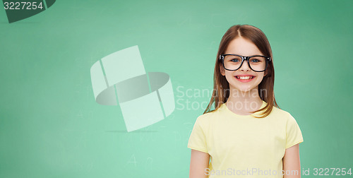 Image of smiling cute little girl in black eyeglasses