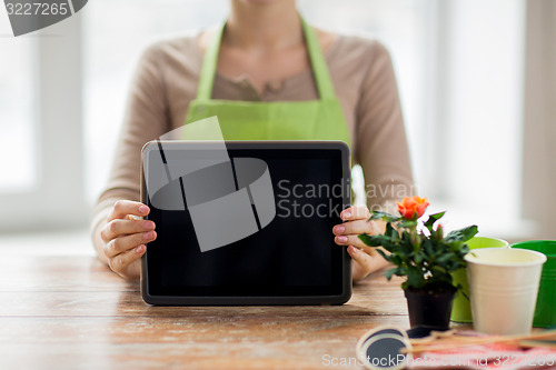 Image of close up of woman or gardener with tablet pc