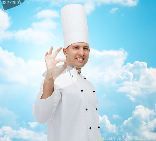 Image of happy male chef cook showing ok sign