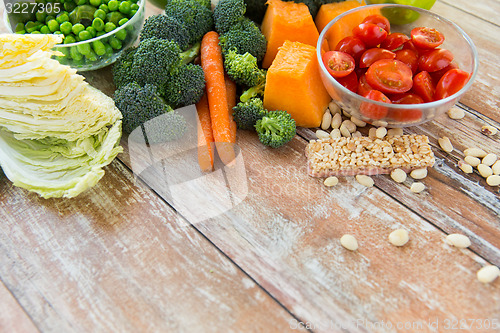 Image of close up of ripe vegetables on wooden table