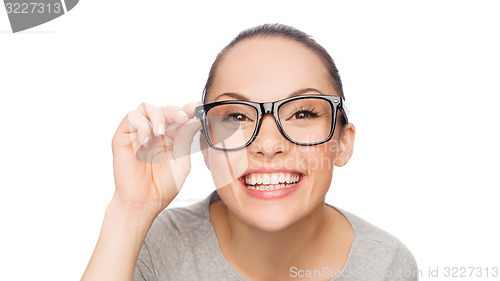 Image of asian woman adjusting eyeglasses