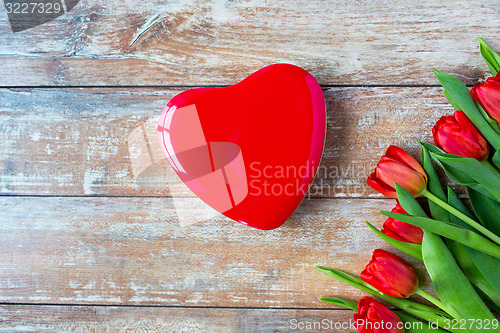 Image of close up of red tulips and chocolate box