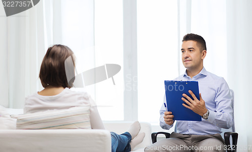 Image of doctor and young woman meeting at home visit