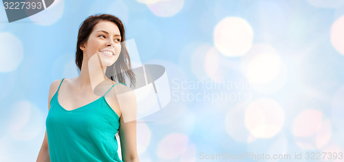 Image of happy girl or young woman looking aside