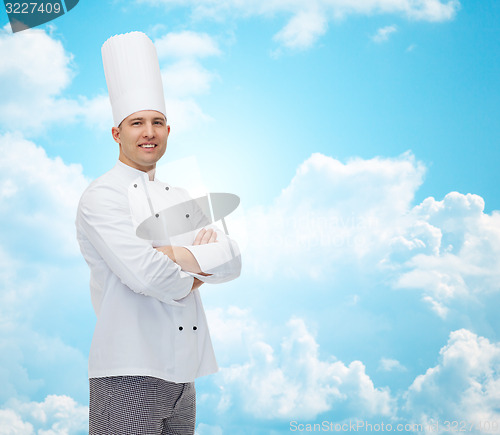 Image of happy male chef cook with crossed hands