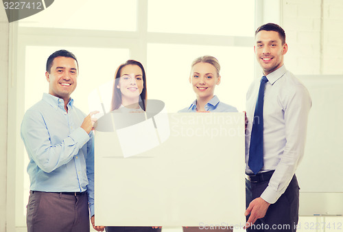 Image of business team in office with white blank board