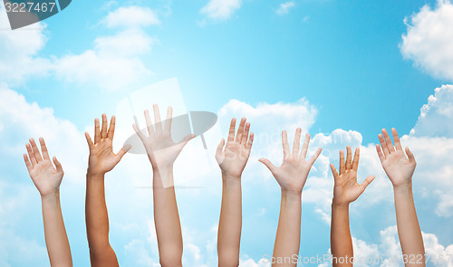 Image of people waving hands