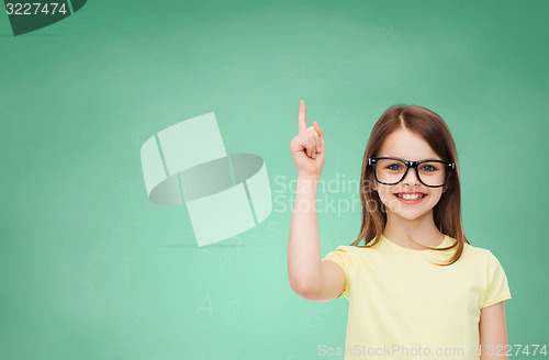 Image of smiling cute little girl in black eyeglasses