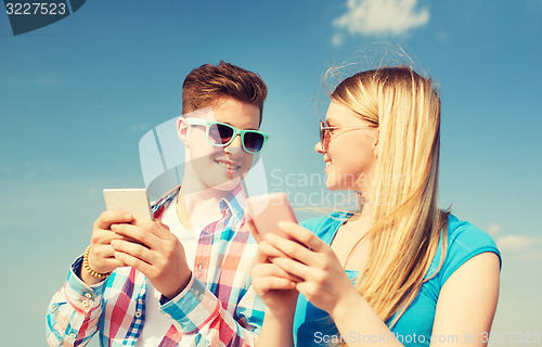 Image of smiling couple having fun outdoors