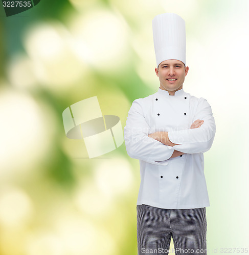 Image of happy male chef cook with crossed hands