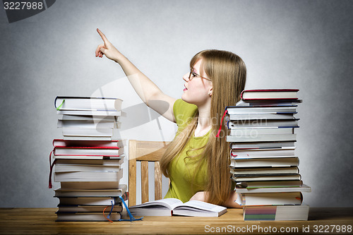 Image of Female teacher pointing back