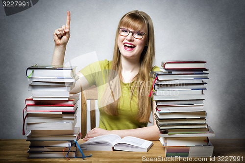 Image of happy student woman with books