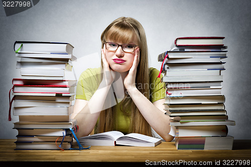 Image of young woman is reading book