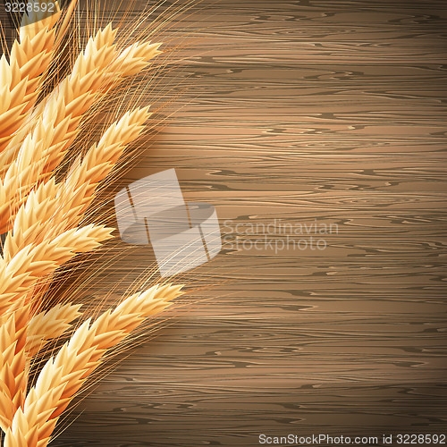 Image of Wheat on the wood background. EPS 10
