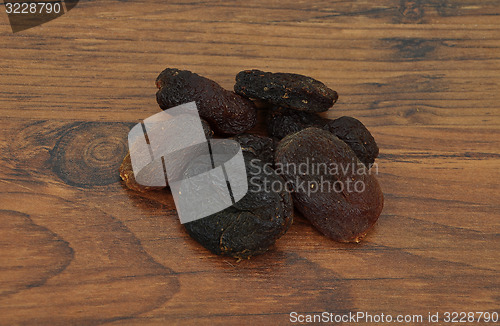 Image of Apricots on wood