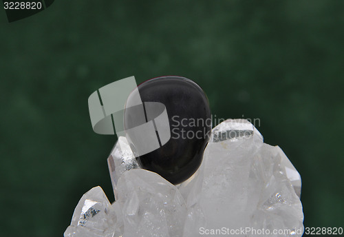 Image of Obsidian on rock crystal