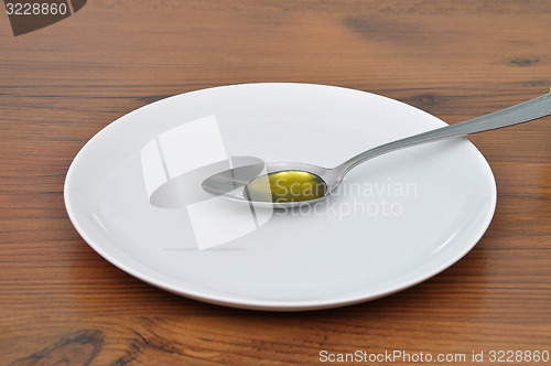 Image of Olive oil on spoon