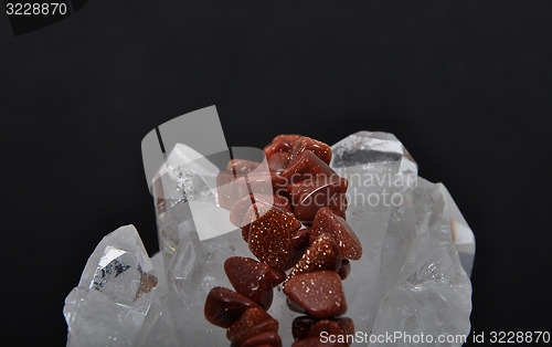 Image of Goldstone on rock crystal