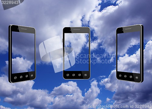 Image of smart-phones transparent on blue sky background