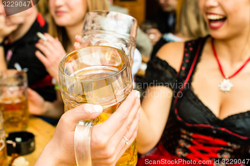 Image of Bavarian girls drinking beer