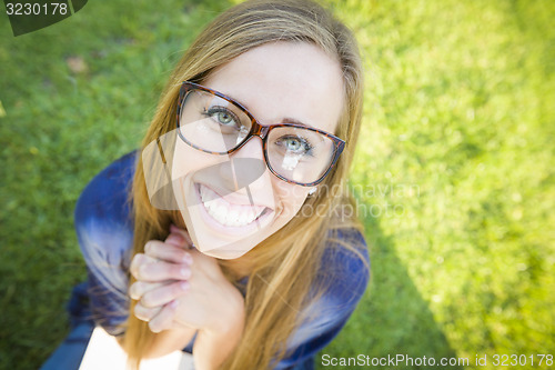 Image of Wide Angle of Pretty Young Woman at the Park