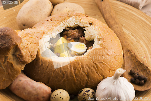 Image of traditional white borscht (zurek) with sausage,egg and mushrooms