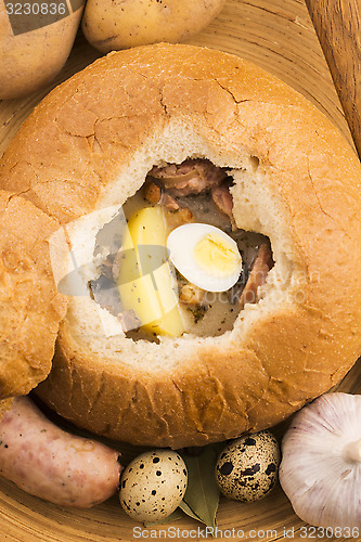 Image of traditional white borscht (zurek) with sausage,egg and mushrooms