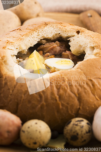 Image of traditional white borscht (zurek) with sausage,egg and mushrooms