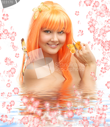 Image of butterfly girl in water with flowers #2