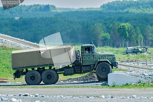 Image of Curtain sided truck comes around on high obstacle