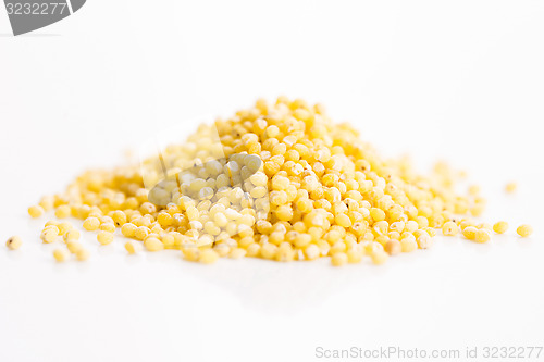 Image of Heap of millet groats on white