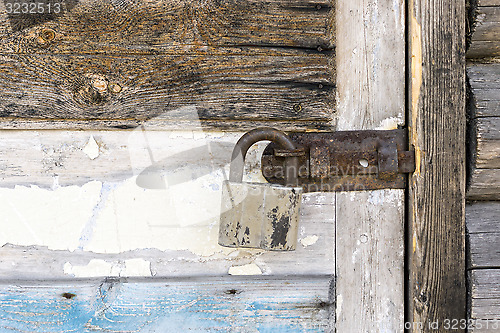 Image of Rustic door locked with padlock