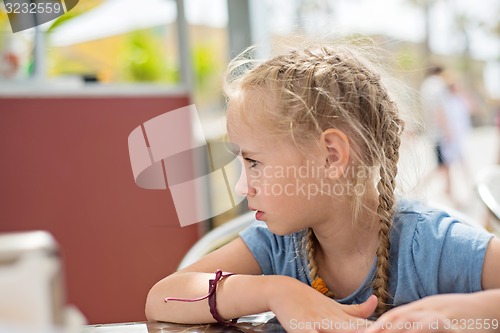 Image of Little girl looking away