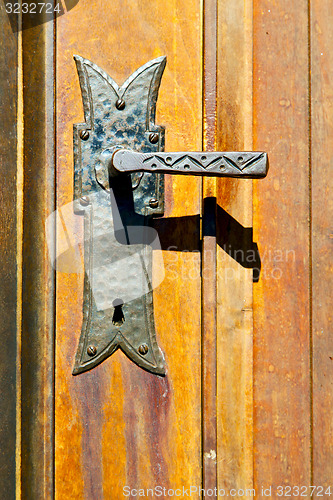 Image of castellanza blur  brown knocker in a  door c  wood italy   cross