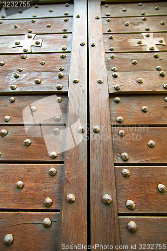 Image of  cross lombardy   arsago seprio  blur  in a  door curch  closed 