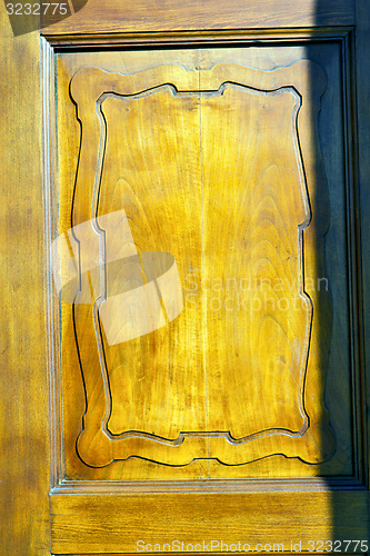 Image of  lombardy   abstract    knocker in a  door curch   italy   cross