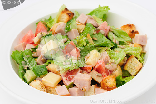 Image of salad with cheese, ham and fresh vegetables