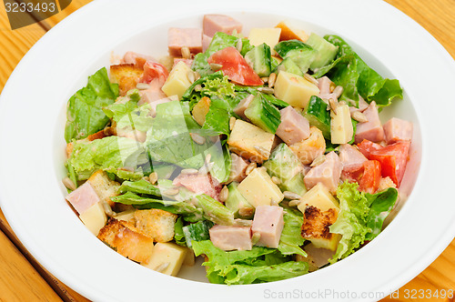 Image of salad with cheese, ham and fresh vegetables