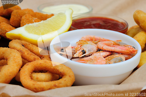 Image of beer snack, shrimps, calmar rings and fish sticks