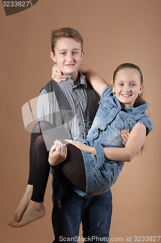 Image of Fashion smiley european siblings posing