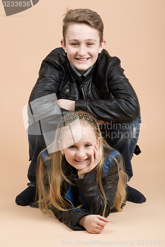 Image of Fashion smiley european siblings posing