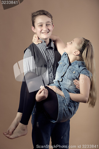 Image of Fashion smiley european siblings posing