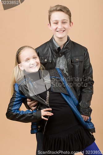 Image of Fashion smiley european siblings posing